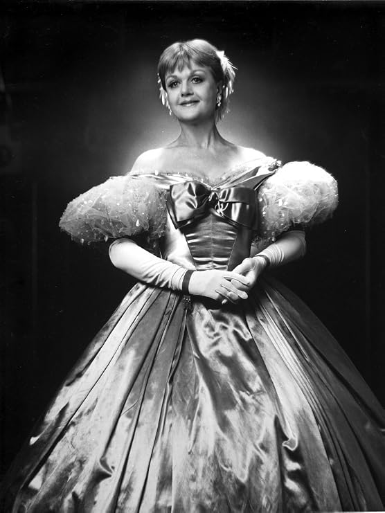 Angela Lansbury standing and wearing a Glossy Dress Photo Print (8 x 10)